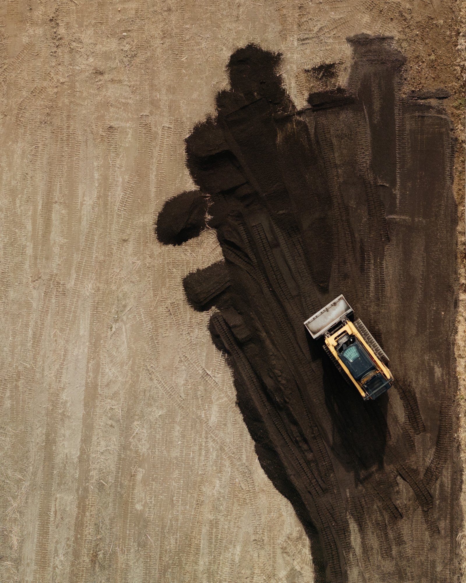Aerial view of J&C Asphalt paving crew working on a Utah County project