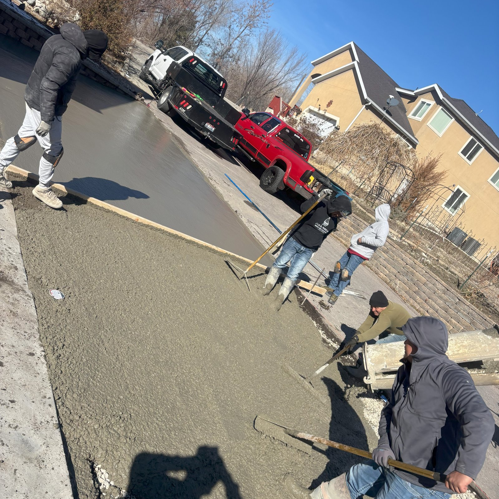 Concrete curb and gutter installation in progress by J&C Asphalt crew